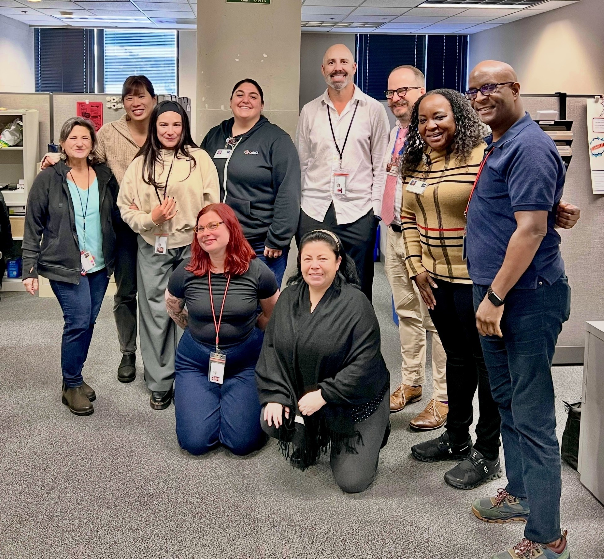 From left: Ellen Stein, Leslie Suen, Kim Fernandez, Alyssa Sweet, Mark Nivet, Dr. Andrew Tompkins, Paulette Walton, Kenny Roosevelt Kneeling: Yvonne Piper, Maria Costa